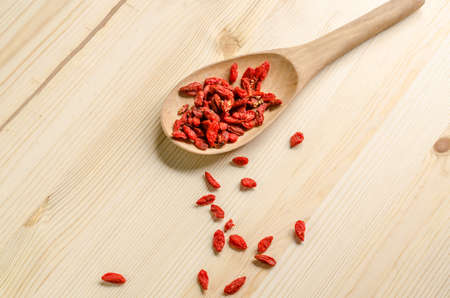Dried goji berries on wooden tablespoonの写真素材