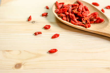 Dried goji berries on wooden tablespoonの写真素材