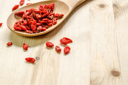 Dried goji berries on wooden tablespoonの写真素材