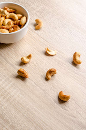 cashew nuts on wooden backgroundの写真素材