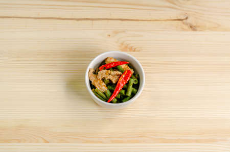 Spicy stir fried pork with red curry paste and Yard Long bean, Thai food menuの写真素材