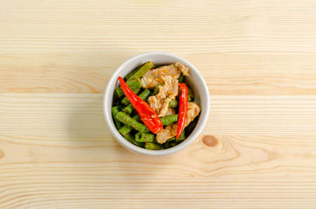 Spicy stir fried pork with red curry paste and Yard Long bean, Thai food menuの写真素材