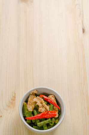 Spicy stir fried pork with red curry paste and Yard Long bean, Thai food menuの写真素材