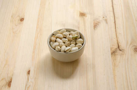 Pistachios Nuts on wooden backgroundの写真素材