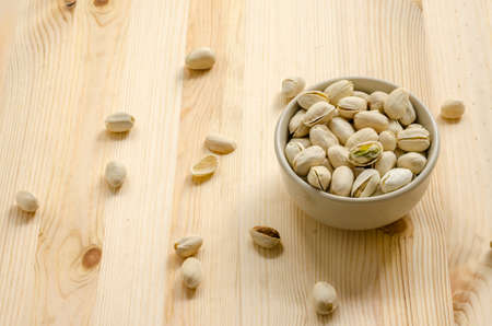 Pistachios Nuts on wooden backgroundの写真素材