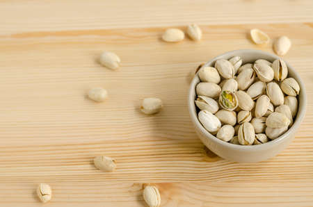 Pistachios Nuts on wooden backgroundの写真素材