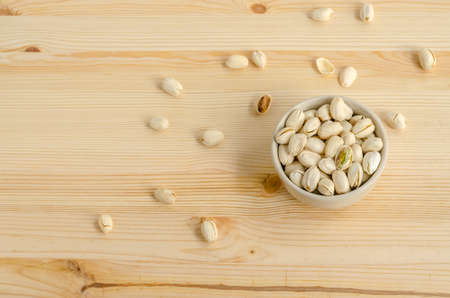Pistachios Nuts on wooden backgroundの写真素材