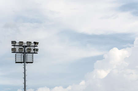 Stadium spotlight and sky in the noonの写真素材