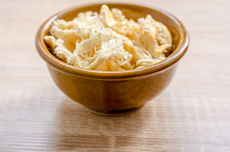 close up in dried squid on wooden backgroundの写真素材