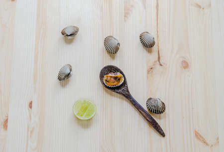 steamed blanched clams wooden backgroundの写真素材