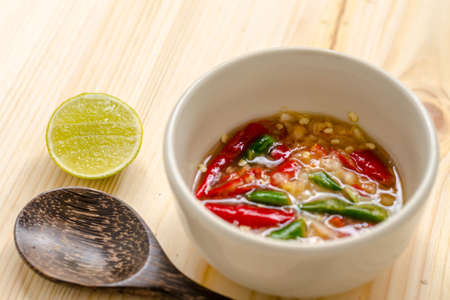 Close up Thai spicy seafood dipping sauce on wooden backgroundの写真素材