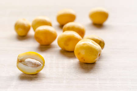 fresh date palm fruits  on wooden background