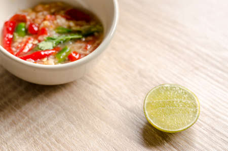 Thai spicy seafood dipping sauce on wooden backgroundの写真素材