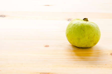 The tropical fruit high vitamin c, fresh guavas on wood backgroundの写真素材