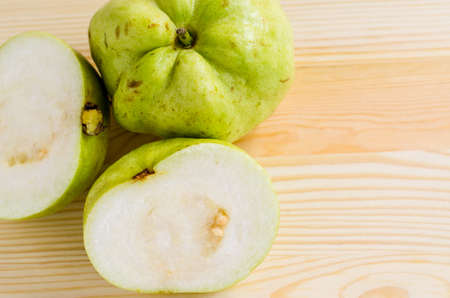 The tropical fruit high vitamin c, fresh guavas on wood backgroundの写真素材
