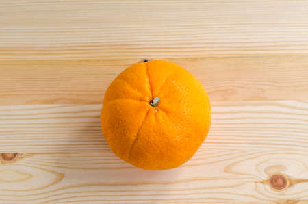 fresh orange on a wooden backgroundの写真素材