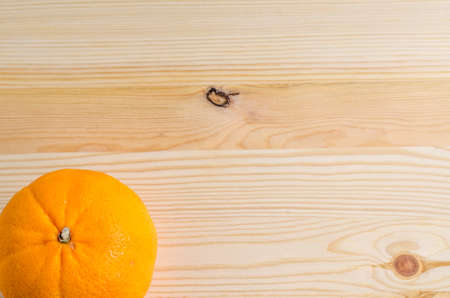 fresh orange on a wooden backgroundの写真素材