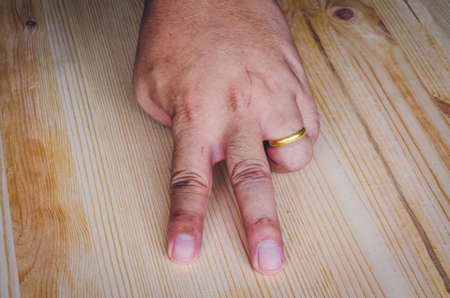 Hand on wooden backgroundの写真素材