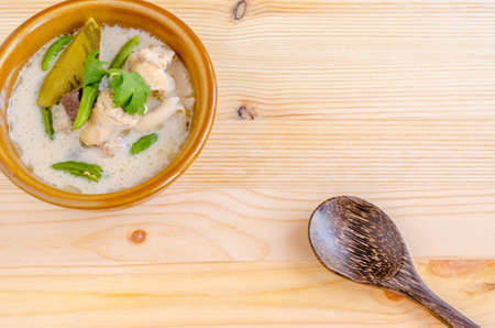 Thai Chicken Soup in Coconut Milk (Tom Kha Gai) on wooden background, thai food.の写真素材