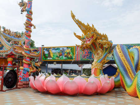 Decoration of naga and lotus flower on thai templeの写真素材