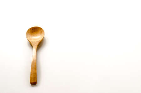 Wooden spoon on the white backgroundの写真素材