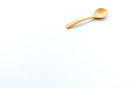 Wooden spoon on the white backgroundの写真素材