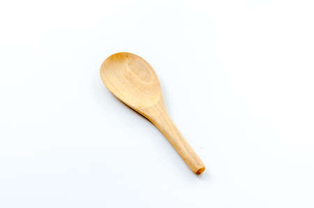 Old wooden ladle on the white backgroundの写真素材