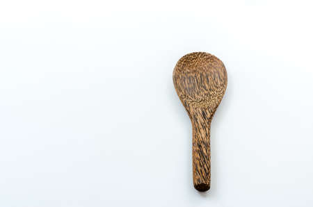 Old wooden ladle on the white backgroundの写真素材