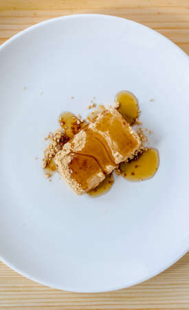 Tsukushi Mochi: Japanese dessert on white dishの写真素材