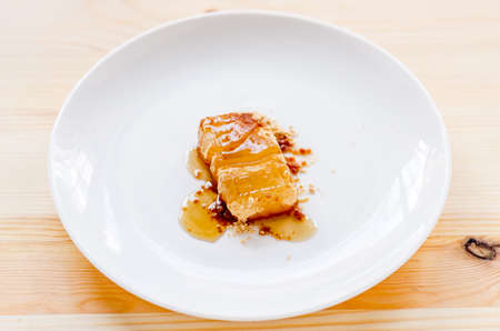 Tsukushi Mochi: Japanese dessert on white dishの写真素材