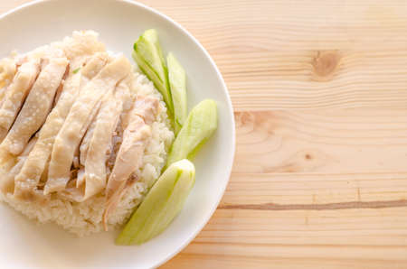 Hainanese chicken rice or rice cooked in chicken brothの写真素材