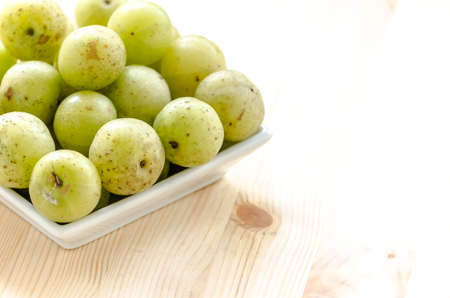 Indian Gooseberry: berry of high vitamin-c on the wooden backgroundの写真素材