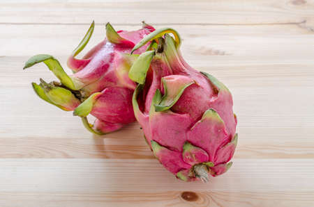 Fresh dragon fruits on wooden background.の写真素材