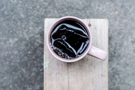 A glass of cola soft drink with iceの写真素材