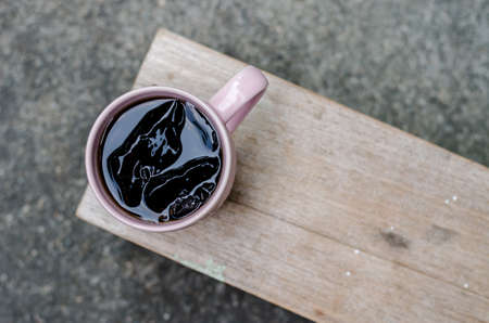 A glass of cola soft drink with iceの写真素材