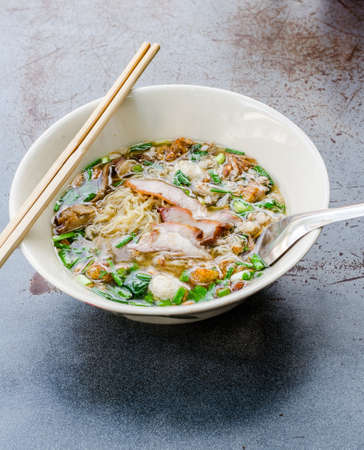 Noodles with pork and pork balls with soup Thai style.