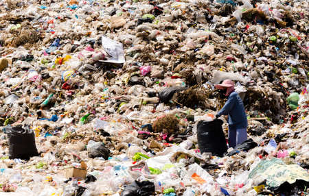MUKDAHAN PROVINCE, THAILAND-FEBRUARY 29: People working in Municipal waste disposal open dump...