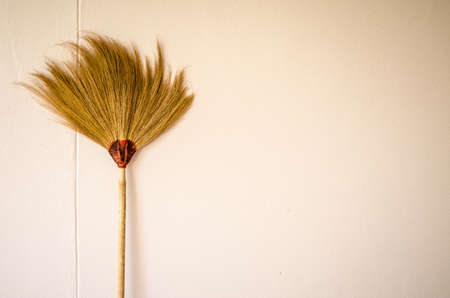 Hand made broom on the old backgroundの写真素材