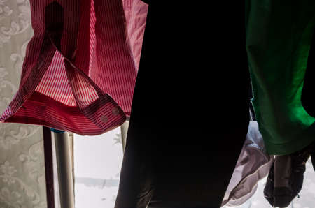 Abstract picture of male shirts on hangersの写真素材