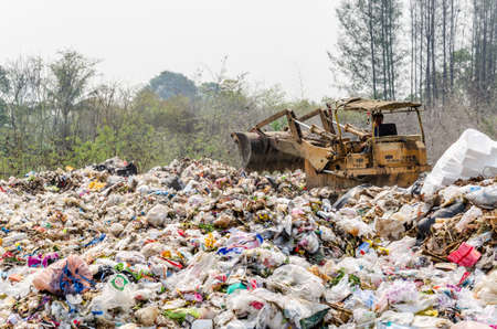 KANCHANABURI PROVINCE, THAILAND-MARCH 17: Worker working in open dump site.  Illegal landfill site  at Kanchanaburi Province on MARCH 17 , 2016 in KANCHANABURI  PROVINCE THAILANDのeditorial素材