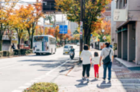 Blurred background. Blurred Japanese family walk  on a city street.のeditorial素材