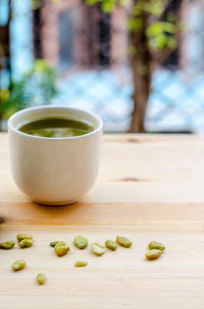 Organic Green Matcha Tea and edible seeds of hyacinth bean snackの写真素材