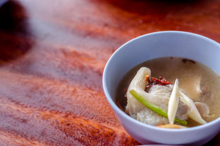 Chicken and shrimp spicy and sour soup, Tom Yum in bowlの写真素材