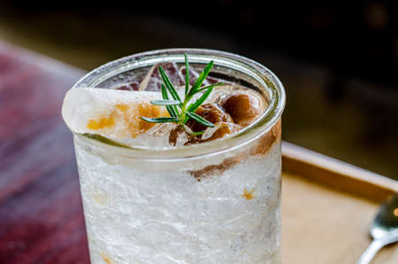 Sour and fresh of yellow plum juice with soft drink, cinematic tone filter and soft focusの写真素材