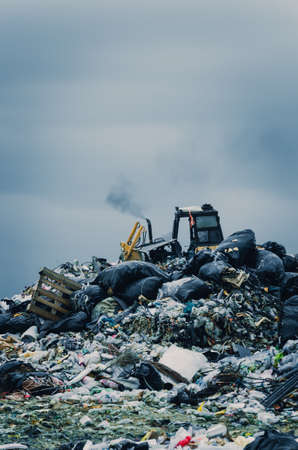 CHONBURI PROVINCE, THAILAND-JULY 13: Picture blur of people working in waste disposal open dump...