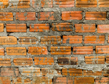 Old orange brick wall texture and background