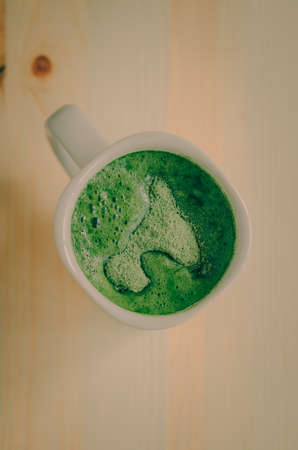Matcha green tea, hot green tea in white cup, vintage tone filterの写真素材
