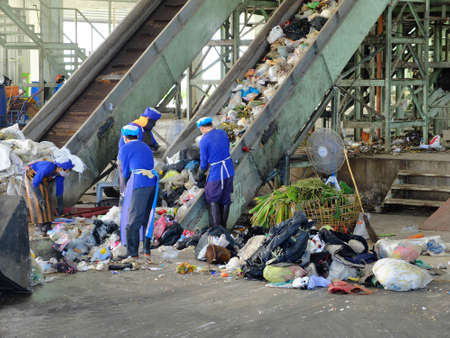 LAMPANGPROVINCE, THAILAND-DECEMBER 7 2016, Women in sepate line collect the plastic and metallic waste from household in waste disposal factory. Recyclable waste in dump siteのeditorial素材