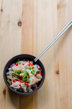 Jelly fish hot spicy and sour salad on wooden table, Thai food thai style.