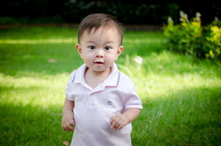 Asia children playing in the garden, happy feel pictureの写真素材